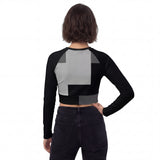 Back view of the all-over print women’s crop top long sleeve. Features the same mirrored design as the front. Abstract Geometry by HOLO streetwear