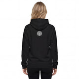Back view of a women’s eco raglan hoodie. Here Circle Notch design placed in the center of the back only features the gray circle superimposed with the inverted curved black lines compared to the front.