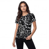 Front view of the Crosswired women’s all-over print T-shirt by HOLO Streetwear, designed with an intricate layout of black lines in different width and length, forming right-angle paths across the tee and contrasted by the white space for a striking abstract effect.