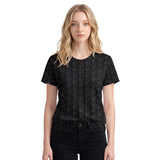 Front view of a women’s all-over printed t-shirt by HOLO streetwear. Dots design is a pattern full of gray dots printed on a black t-shirt.