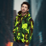 Men’s hoodie cover featuring a model wearing Camo Pop, standing against an urban city background.