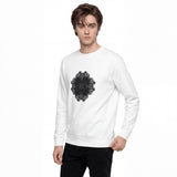 A man wearing a white crewneck sweatshirt with a black mandala graphic on the chest, paired with black pants, against a plain white background.