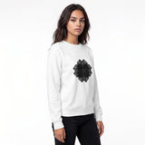 A woman modeling a white crewneck sweatshirt with a black mandala graphic on the chest, paired with black pants, against a plain white background.