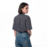 Back view of an all-over print women’s button shirt. Features the same mirrored design as the front.